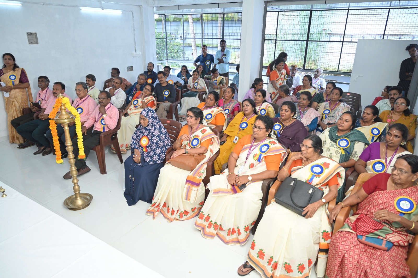 Farmer-shareholders seated at a members' meeting