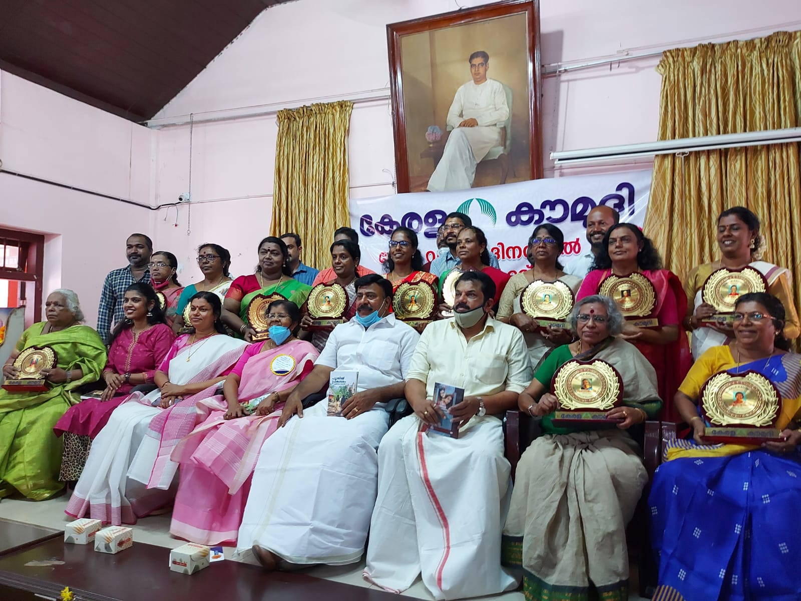 Women members of the collective holding their awards at a ceremony